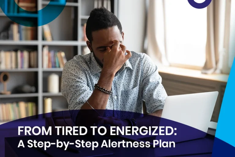 Man feeling tired at desk with laptop – From Tired to Energized: A Step-by-Step Alertness Plan